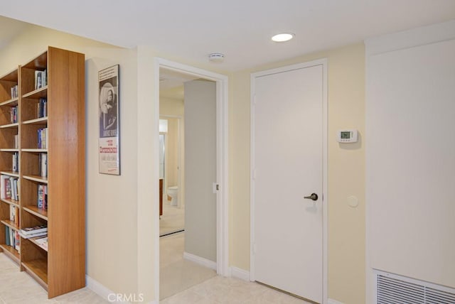 corridor featuring light tile patterned flooring