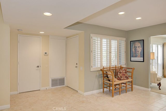 entrance foyer with light tile patterned floors