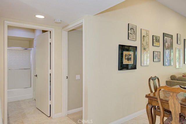 hall featuring light tile patterned floors