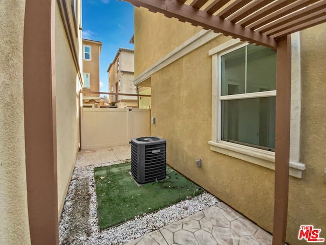 view of home's exterior with central AC unit