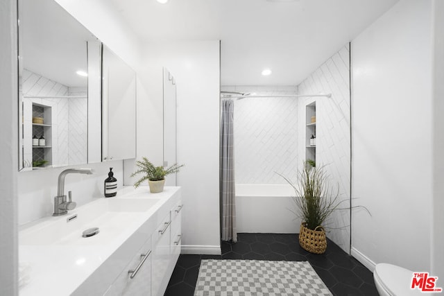 bathroom featuring toilet, tile patterned floors, and vanity