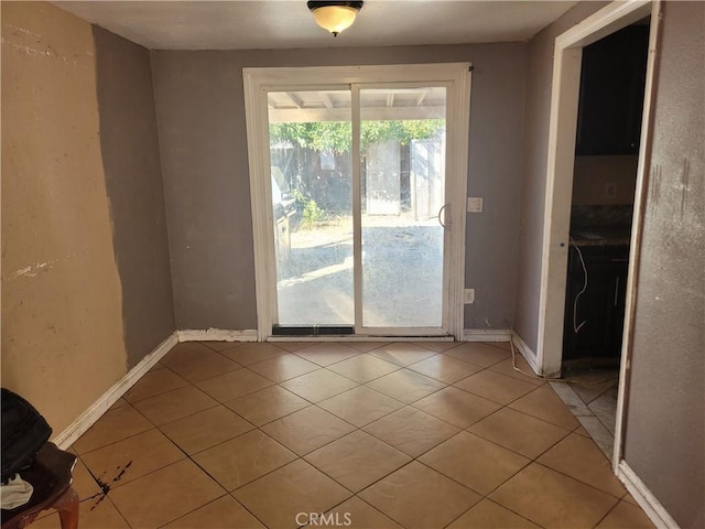 doorway featuring light tile patterned floors