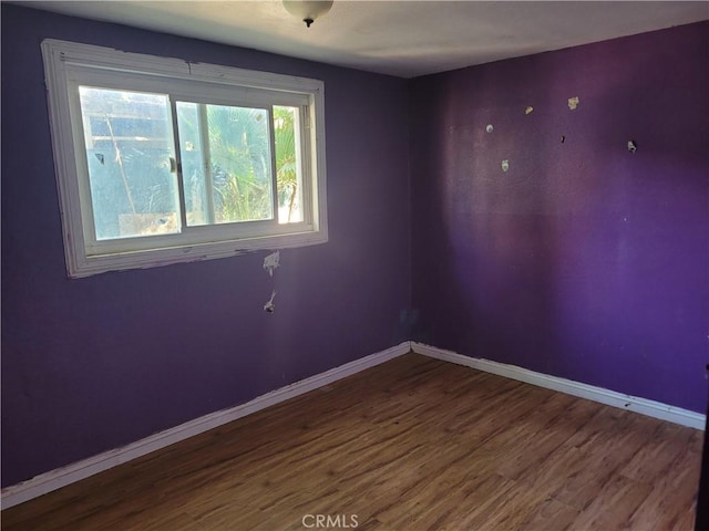 spare room featuring hardwood / wood-style floors