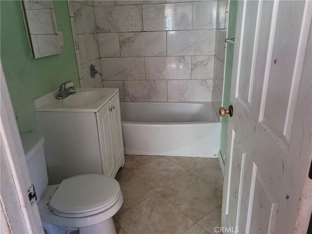 bathroom with tile patterned floors, vanity, and toilet