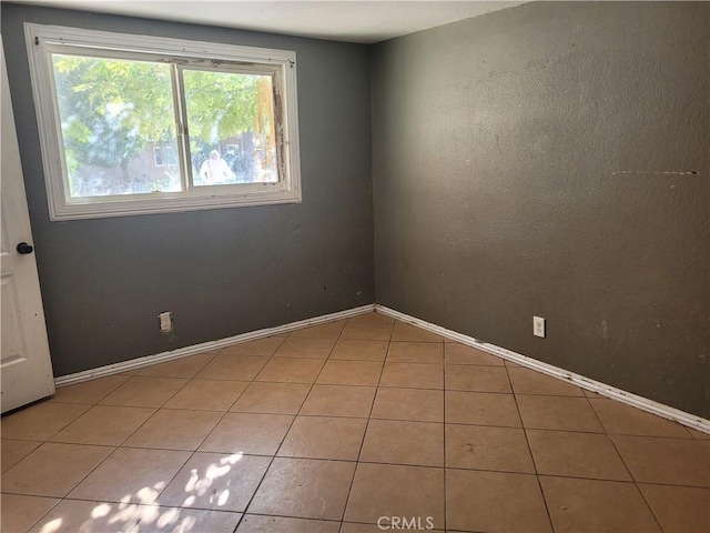 view of tiled spare room