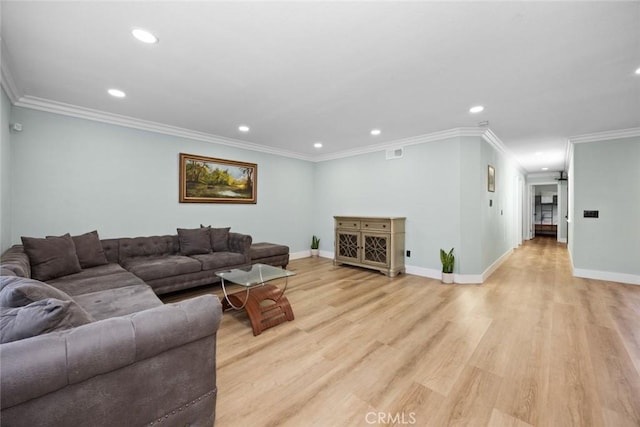 living room featuring light hardwood / wood-style flooring and ornamental molding