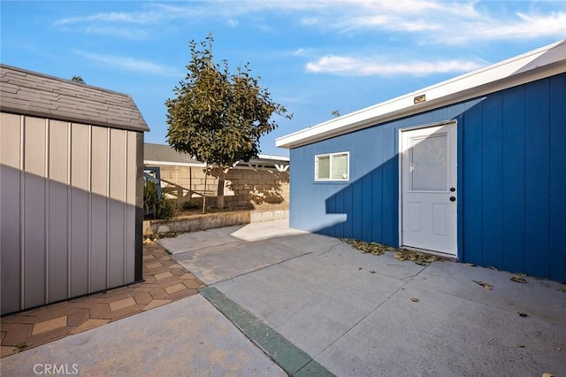 view of patio with a shed