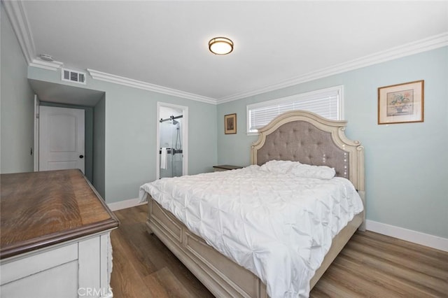 bedroom with hardwood / wood-style floors and crown molding