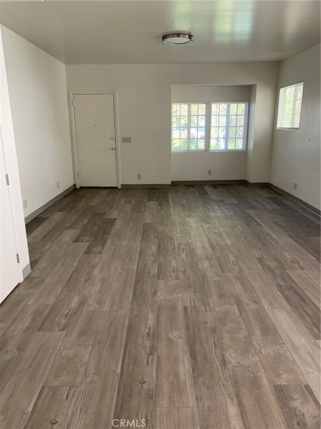 unfurnished room with light hardwood / wood-style flooring