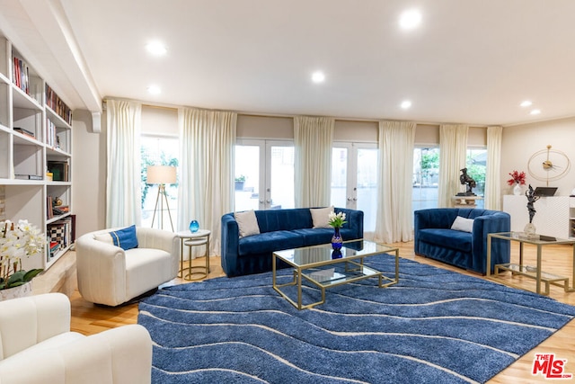 living room featuring french doors and light hardwood / wood-style flooring