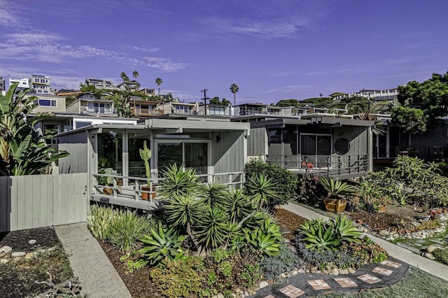 back of property featuring a sunroom