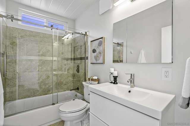 full bathroom featuring toilet, enclosed tub / shower combo, and vanity