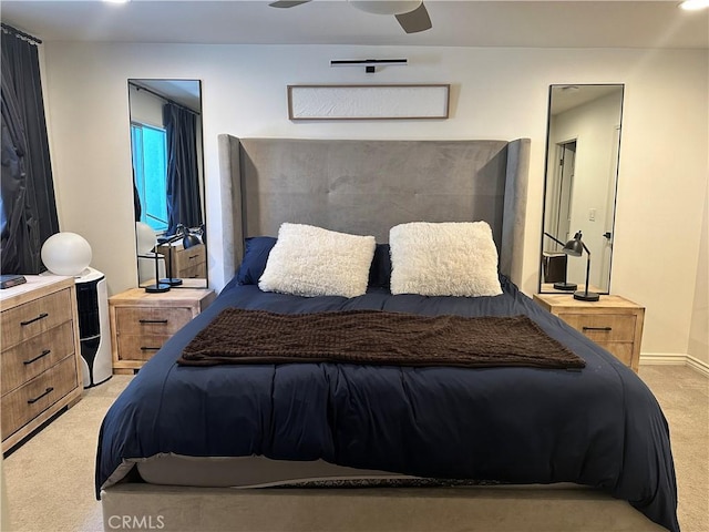 carpeted bedroom featuring ceiling fan