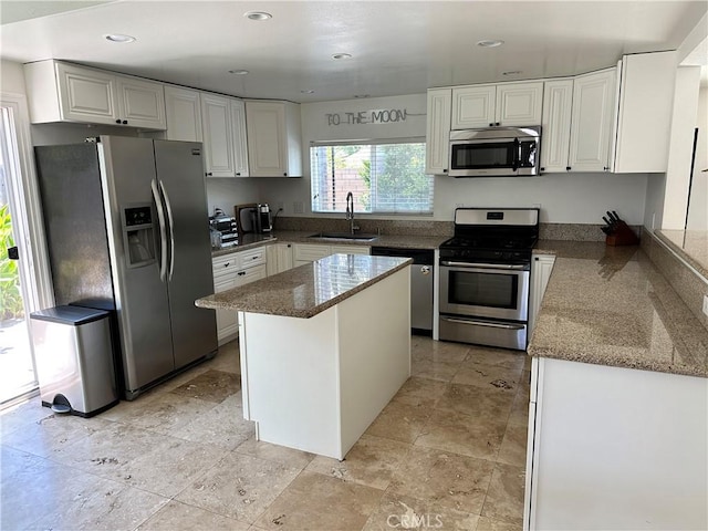 20871 Crestview Ln, Huntington Beach, CA 92646 - kitchen featuring stainless steel appliances, a sink, white cabinets, dark stone countertops, and recessed lighting