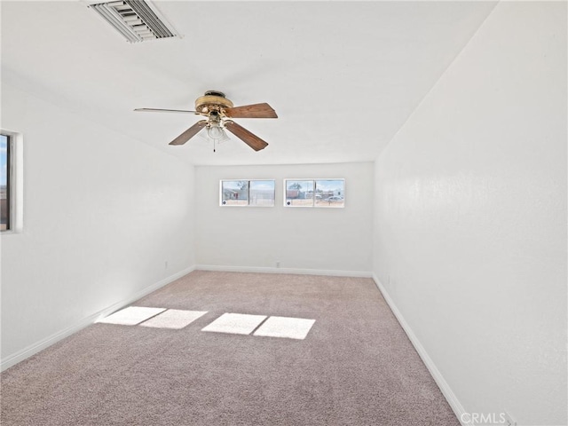 spare room with light carpet and ceiling fan