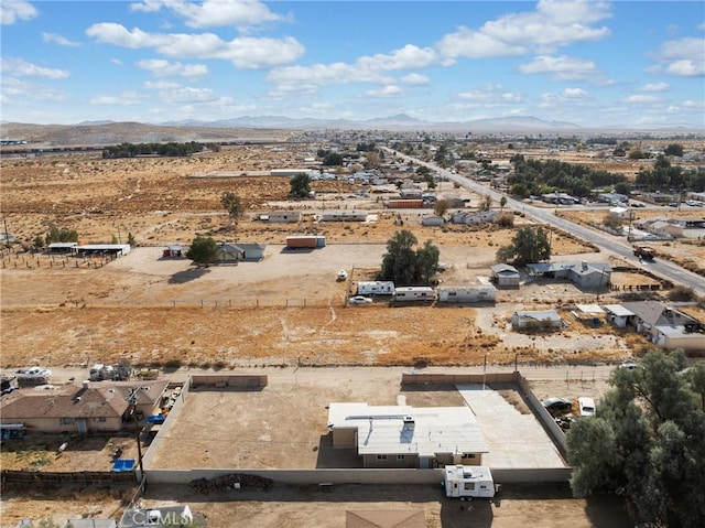 birds eye view of property featuring a mountain view