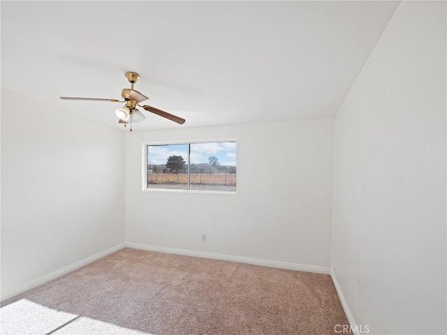 unfurnished room featuring light colored carpet and ceiling fan