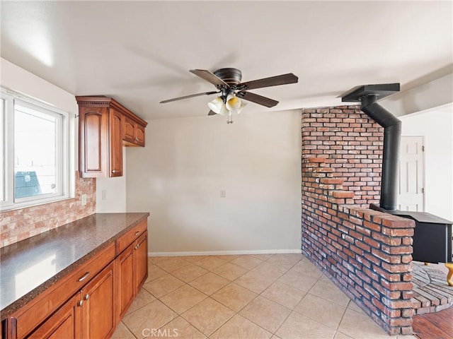 kitchen with ceiling fan and light tile patterned flooring