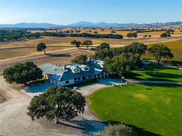 drone / aerial view with a mountain view and a rural view