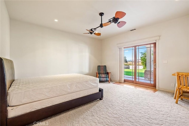 carpeted bedroom with access to outside and ceiling fan