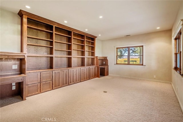 unfurnished living room with carpet floors