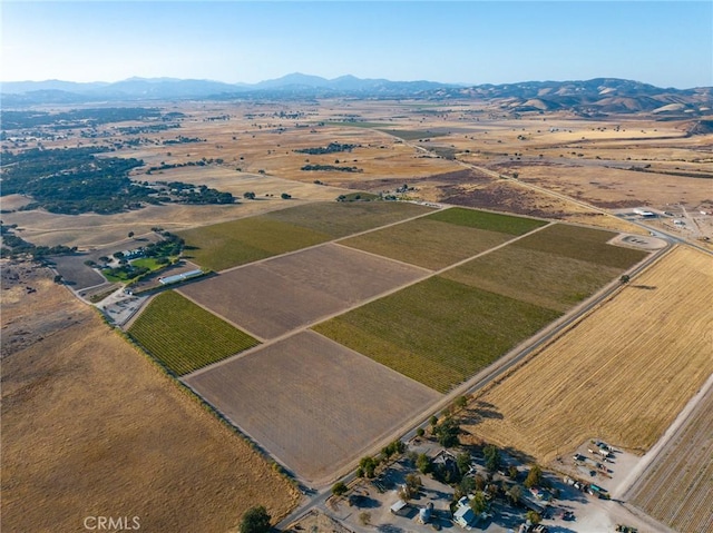 aerial view with a mountain view and a rural view