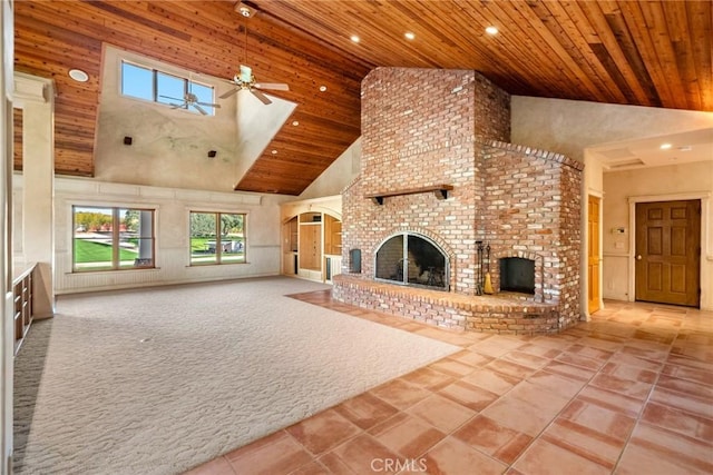 unfurnished living room with ceiling fan, a fireplace, high vaulted ceiling, and wooden ceiling