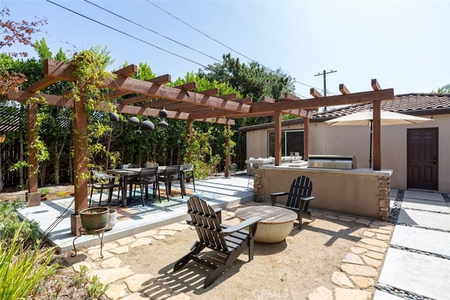 view of patio / terrace with a pergola and an outdoor kitchen