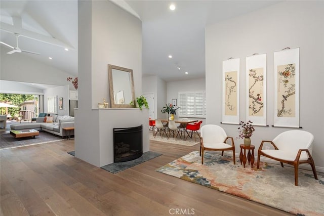 interior space with hardwood / wood-style floors and high vaulted ceiling