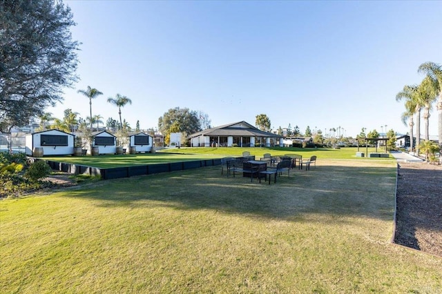 view of home's community featuring a yard