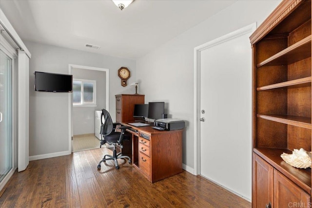 office space with dark wood-type flooring