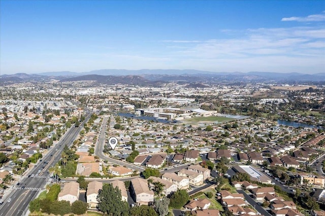 birds eye view of property with a mountain view