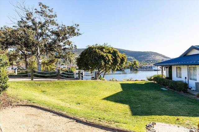 view of yard featuring volleyball court and a water and mountain view