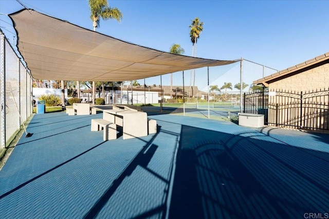 view of patio / terrace featuring tennis court