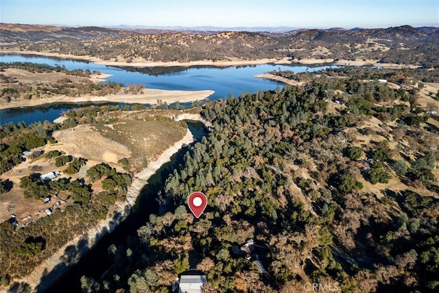 birds eye view of property featuring a water and mountain view