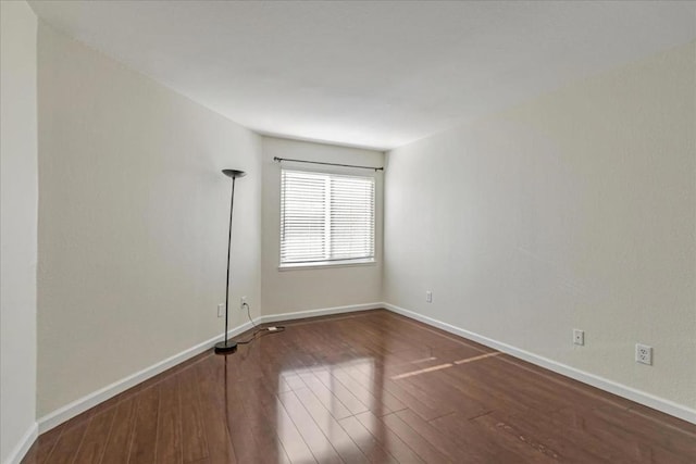 spare room with hardwood / wood-style flooring