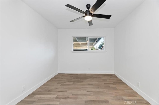 spare room featuring ceiling fan and light hardwood / wood-style floors