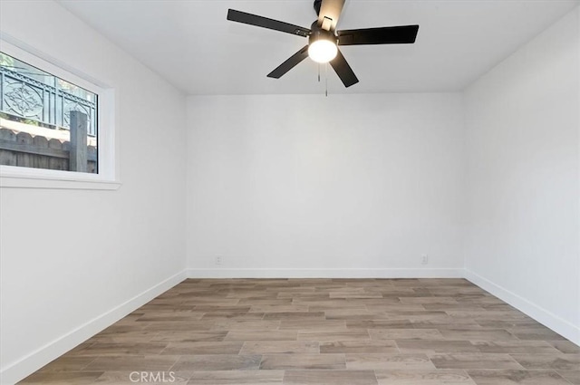 unfurnished room featuring light hardwood / wood-style floors and ceiling fan