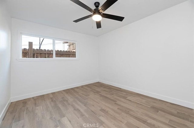 spare room featuring ceiling fan and light wood-type flooring