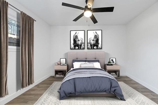 bedroom with hardwood / wood-style floors and ceiling fan