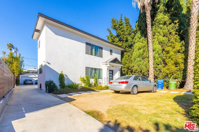 view of front of property with an outbuilding and a garage