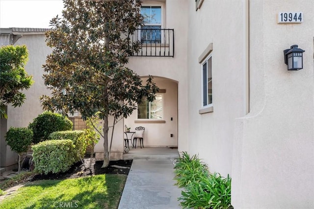 doorway to property featuring a balcony