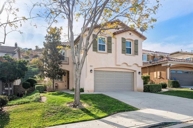 mediterranean / spanish-style house with a garage