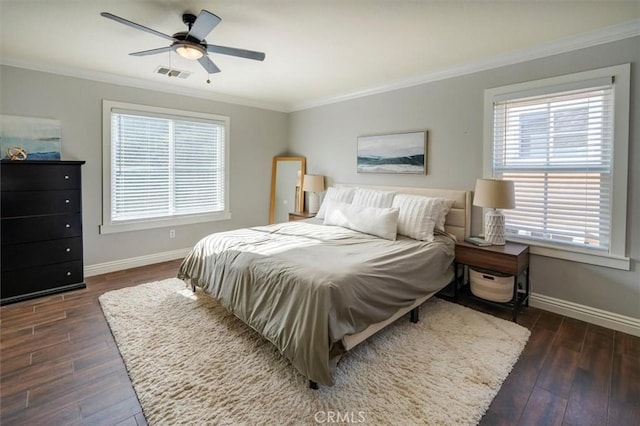 bedroom with ceiling fan, dark hardwood / wood-style flooring, and crown molding