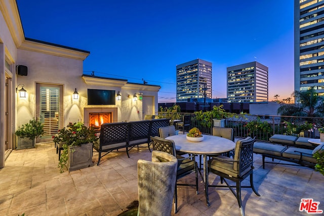 view of patio / terrace with exterior fireplace