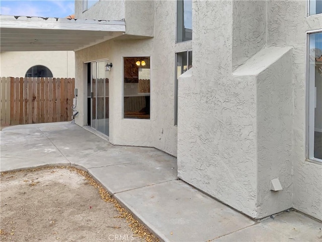 property entrance featuring a patio area