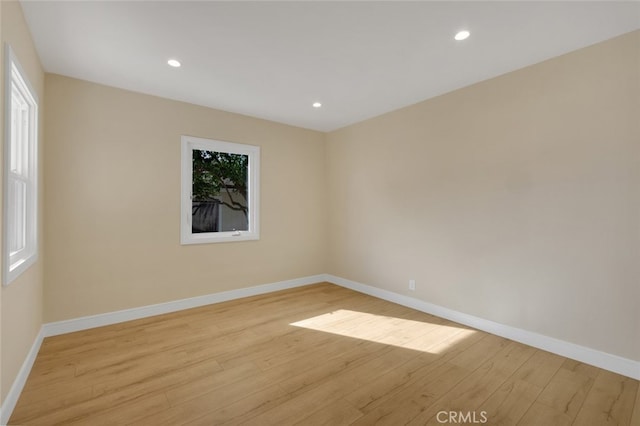 empty room with light hardwood / wood-style floors