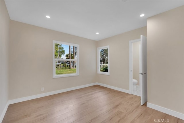 spare room with light wood-type flooring