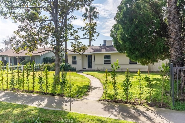 ranch-style house with a front yard