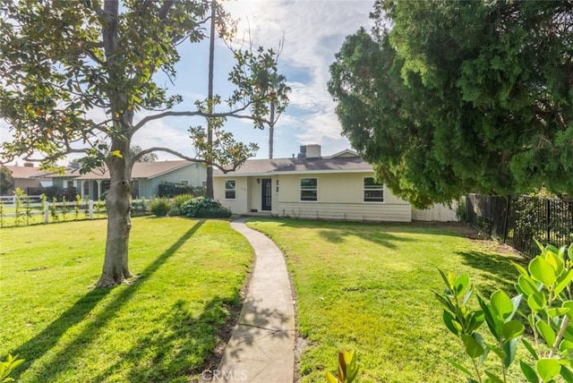 view of front of home with a front lawn